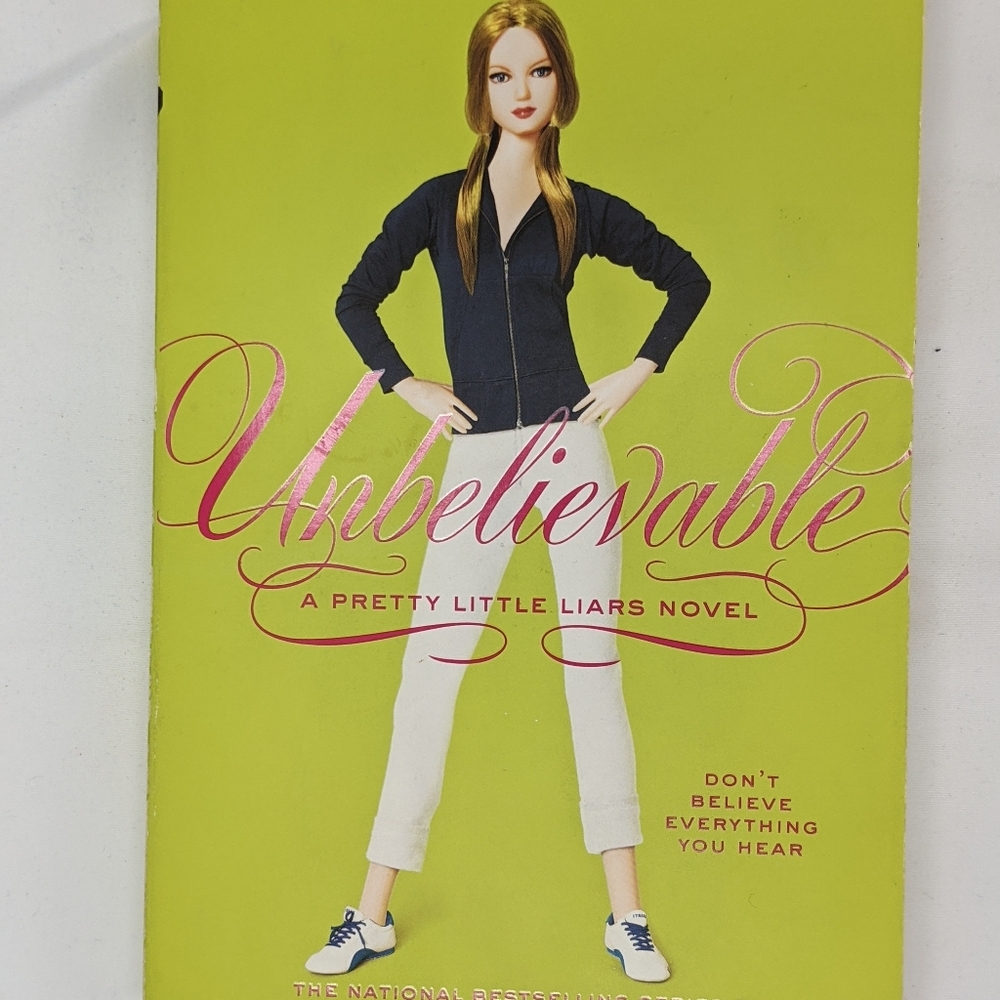 Paperback copy of Unbelievable (PLL series)